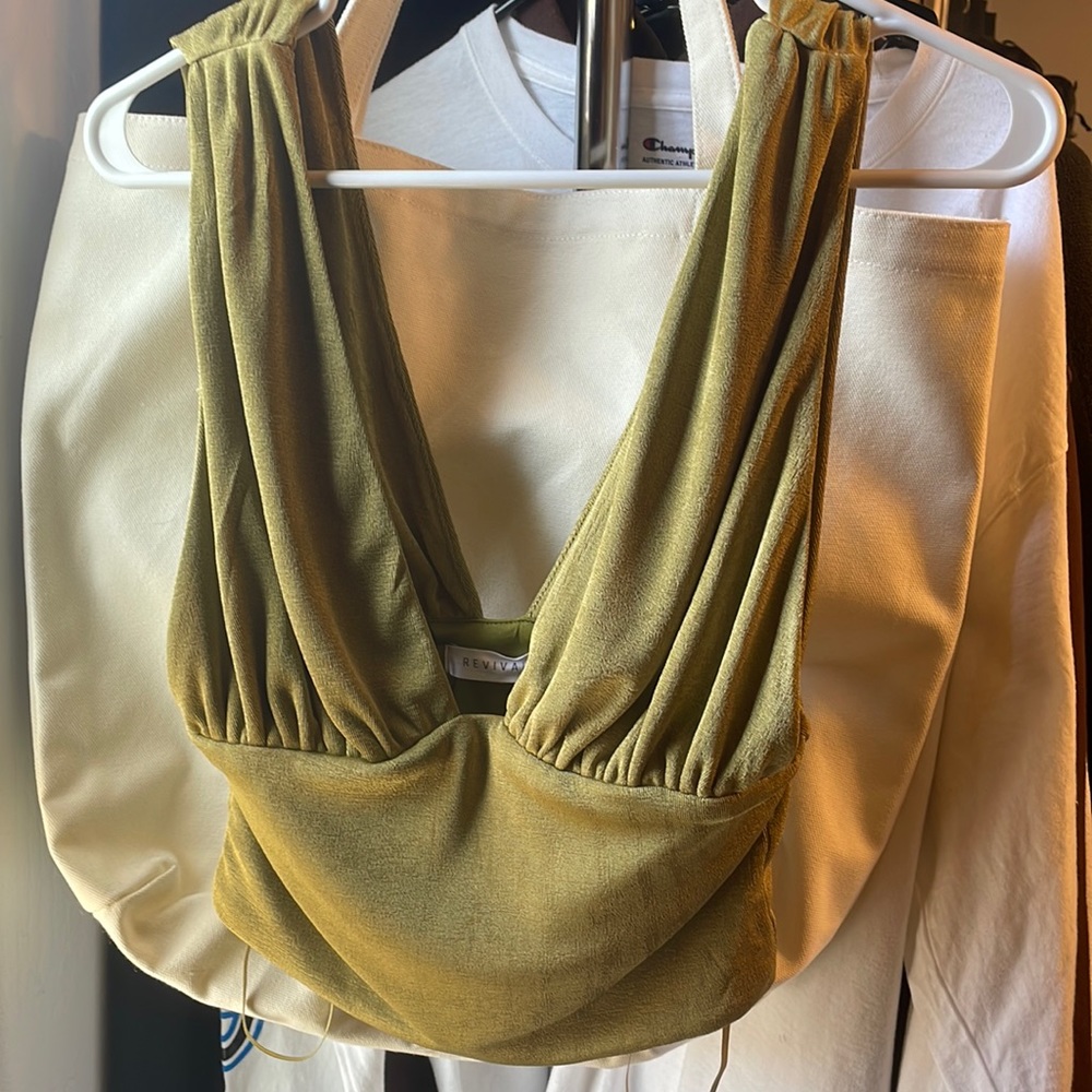 Never worn. Beautiful olive green top.